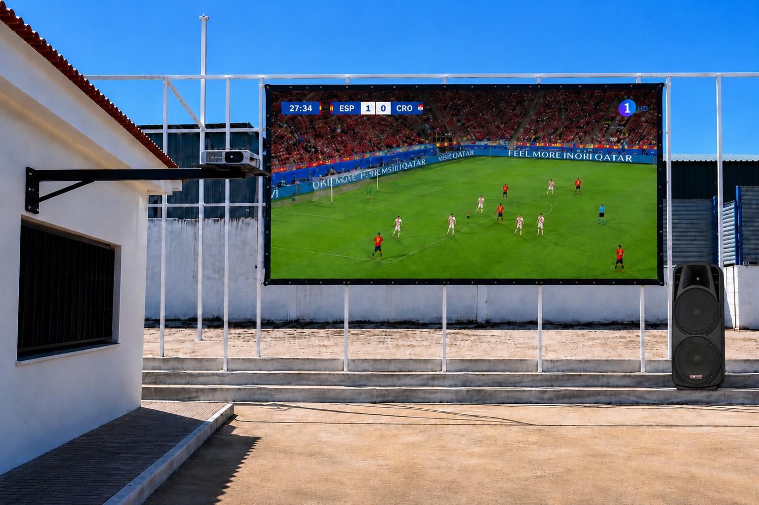 Pantalla gigante al aire libre en El Colorao, con un partido de fútbol